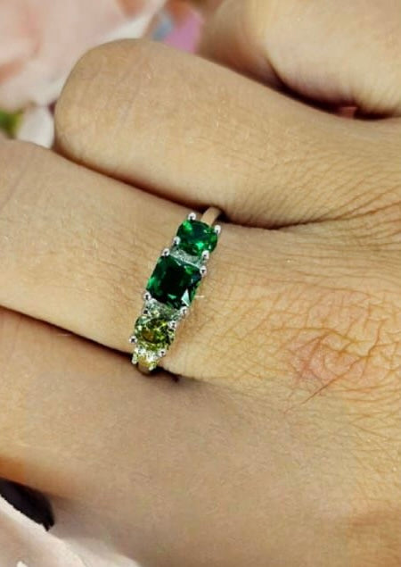 Sterling silver ring with shades of green cubic zirconia stones