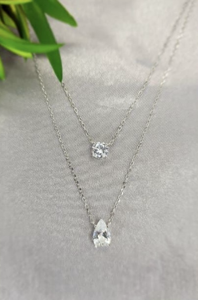 Stunning double layer necklace with round and teardrop cubic zirconia crystals