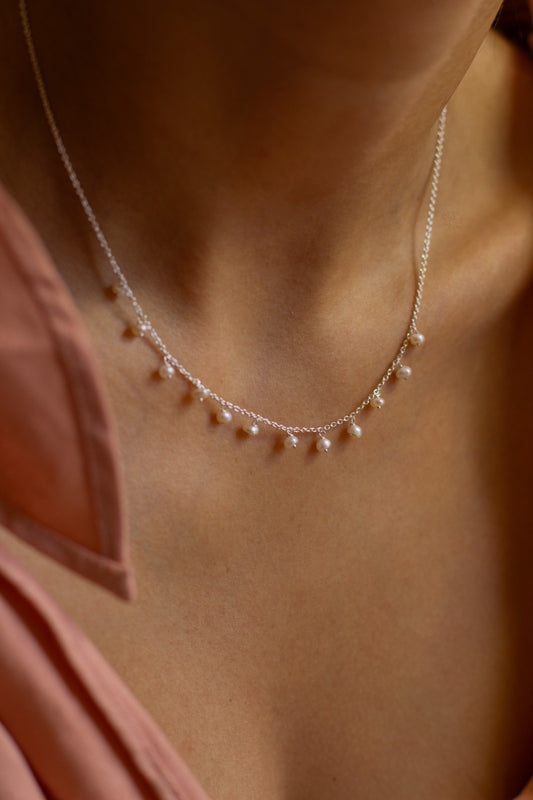 Sterling silver necklace with lots of dangling freshwater pearls