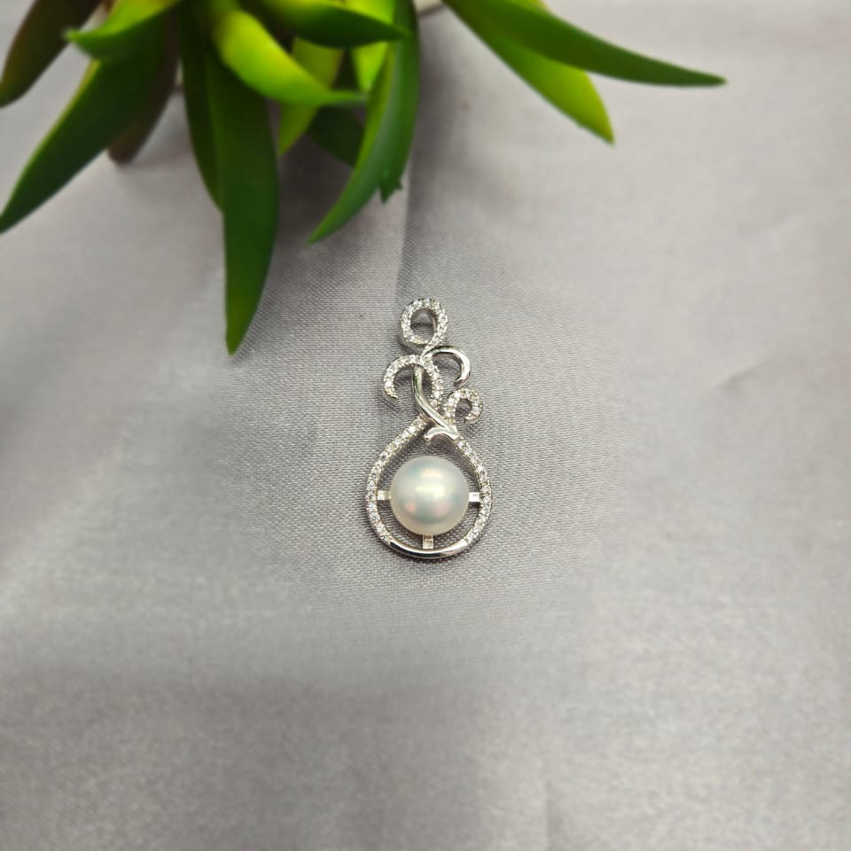 Intrigue Looking Sterling Silver Pendant With Cubic Zirconia Insets Rounding A Beautiful Freshwater Pearl