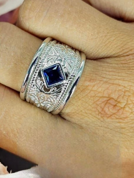 Sterling silver filigree ring with diamond shape blue cubic zirconia