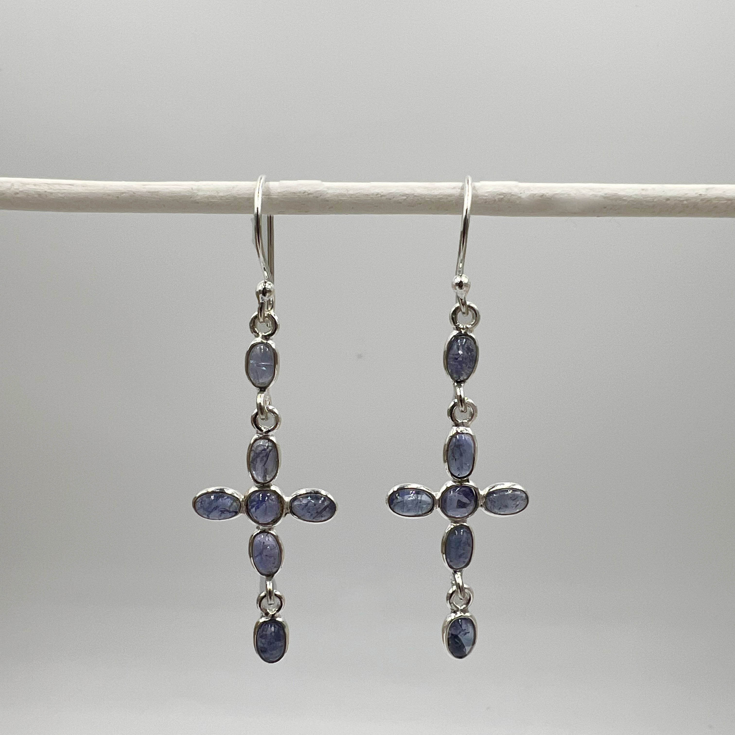 A pair of tourmaline semi precious stone drop earrings in sterling silver, displayed against a light background.