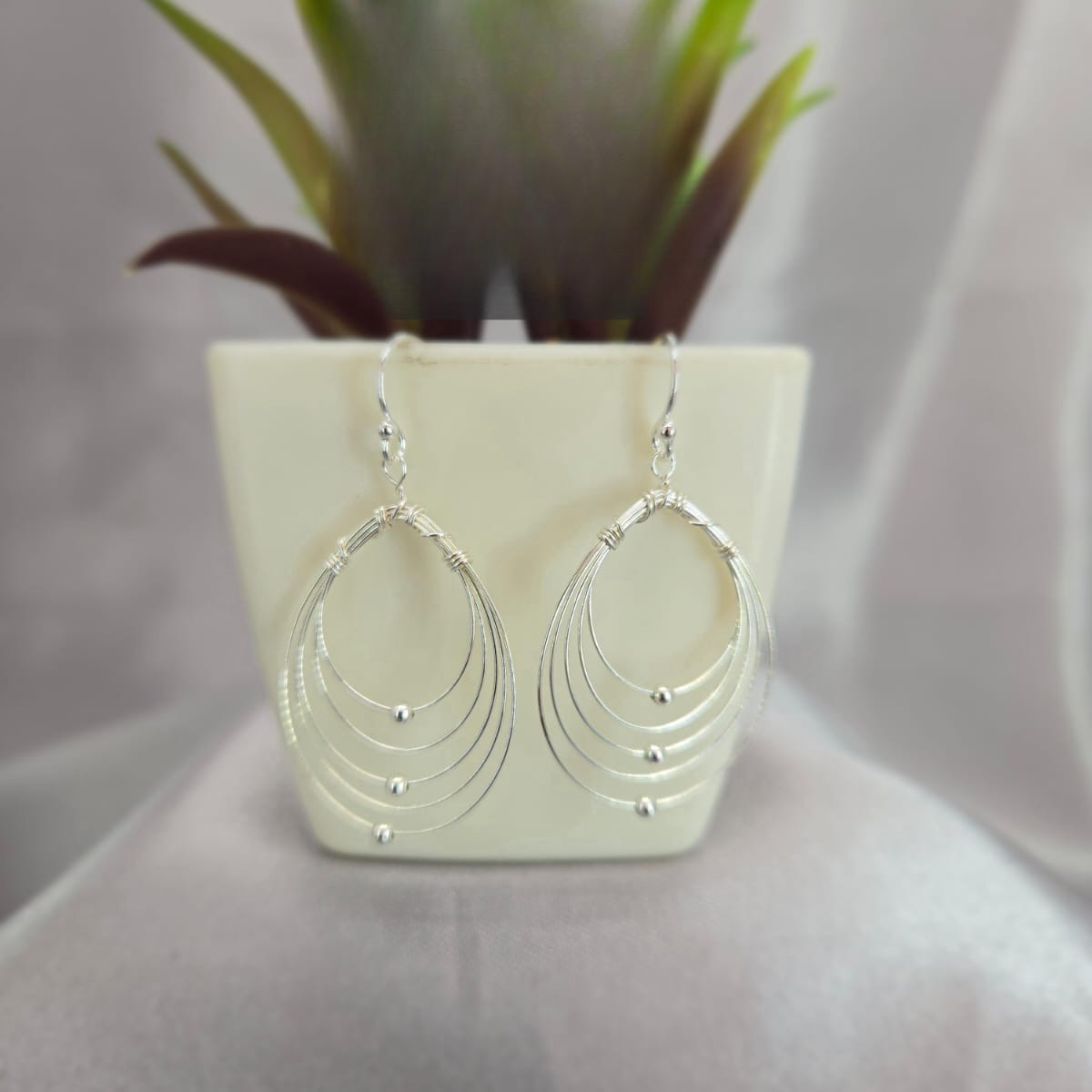 Lots Of Large Ovals On Drop Earring With Ball Detail