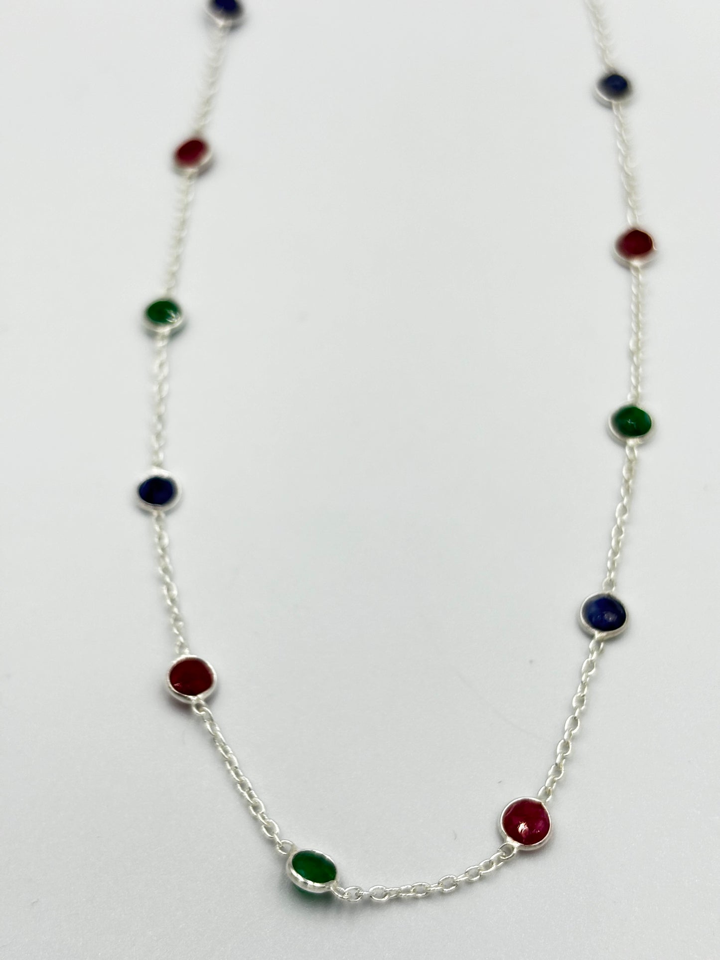 Sterling silver necklace with blue, green and red semi precious stones in chain