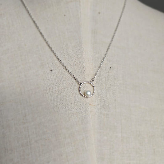 Sterling silver necklace with round circle detail and freshwater pearl