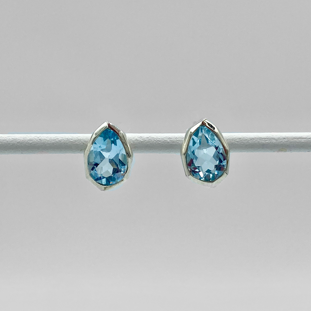 A pair of blue topaz semi precious stone stud earrings in silver.