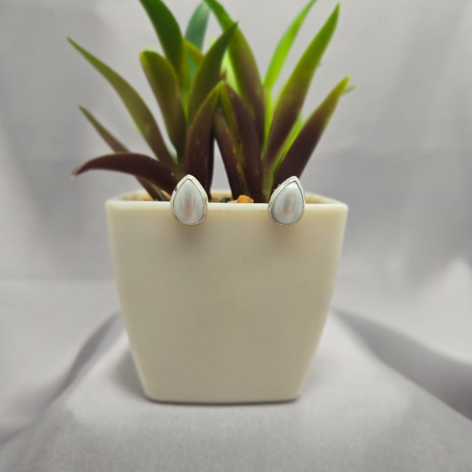 Teardrop pearl stud earrings in tube setting