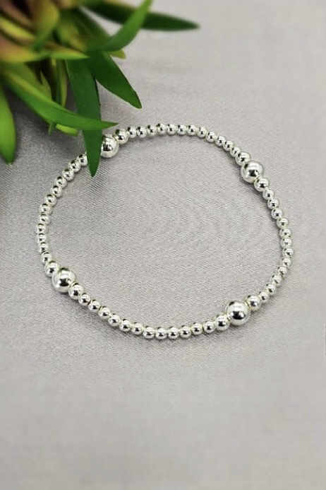 Sterling silver ball bracelet on elastic band