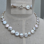 Pearl necklace on a mannequin with close-up inset showing clasp details.