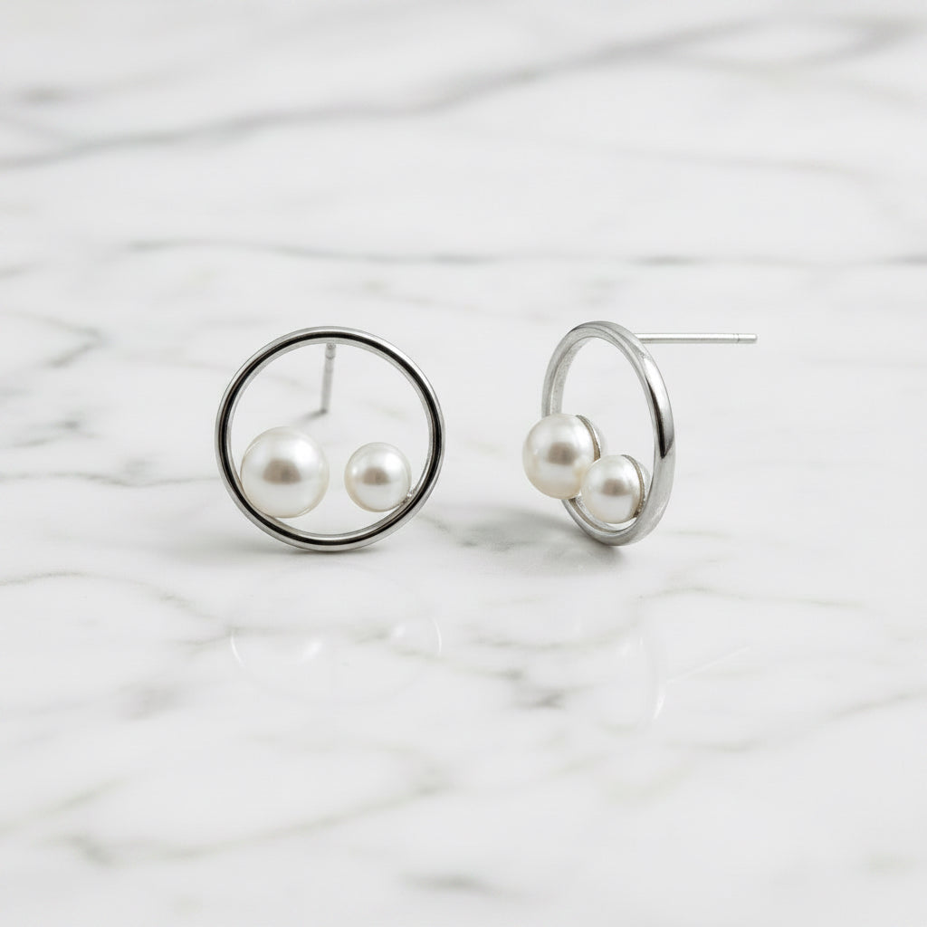 Sterling silver circle stud earrings with two freshwater pearls in circle