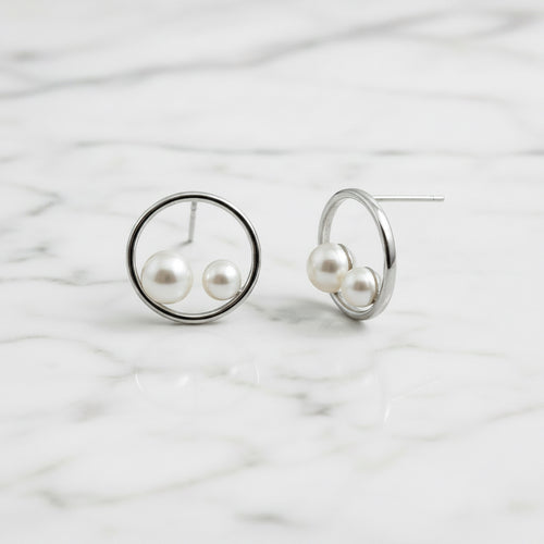Sterling silver circle stud earrings with two freshwater pearls in circle