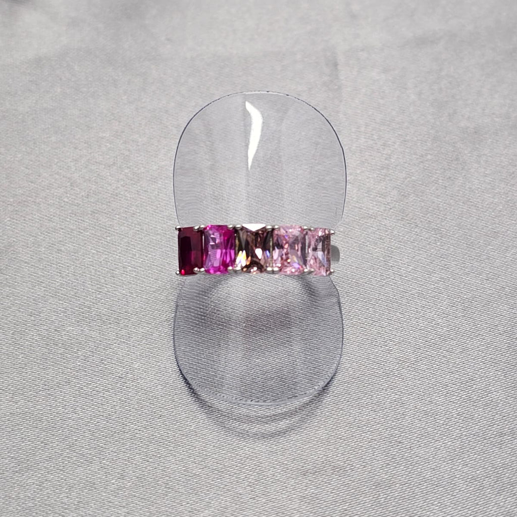 A sterling silver ring with intricate baguette cubic zirconia detailing, displayed on a plain background.