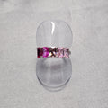 A sterling silver ring with intricate baguette cubic zirconia detailing, displayed on a plain background.