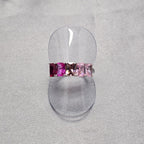 A sterling silver ring with intricate baguette cubic zirconia detailing, displayed on a plain background.
