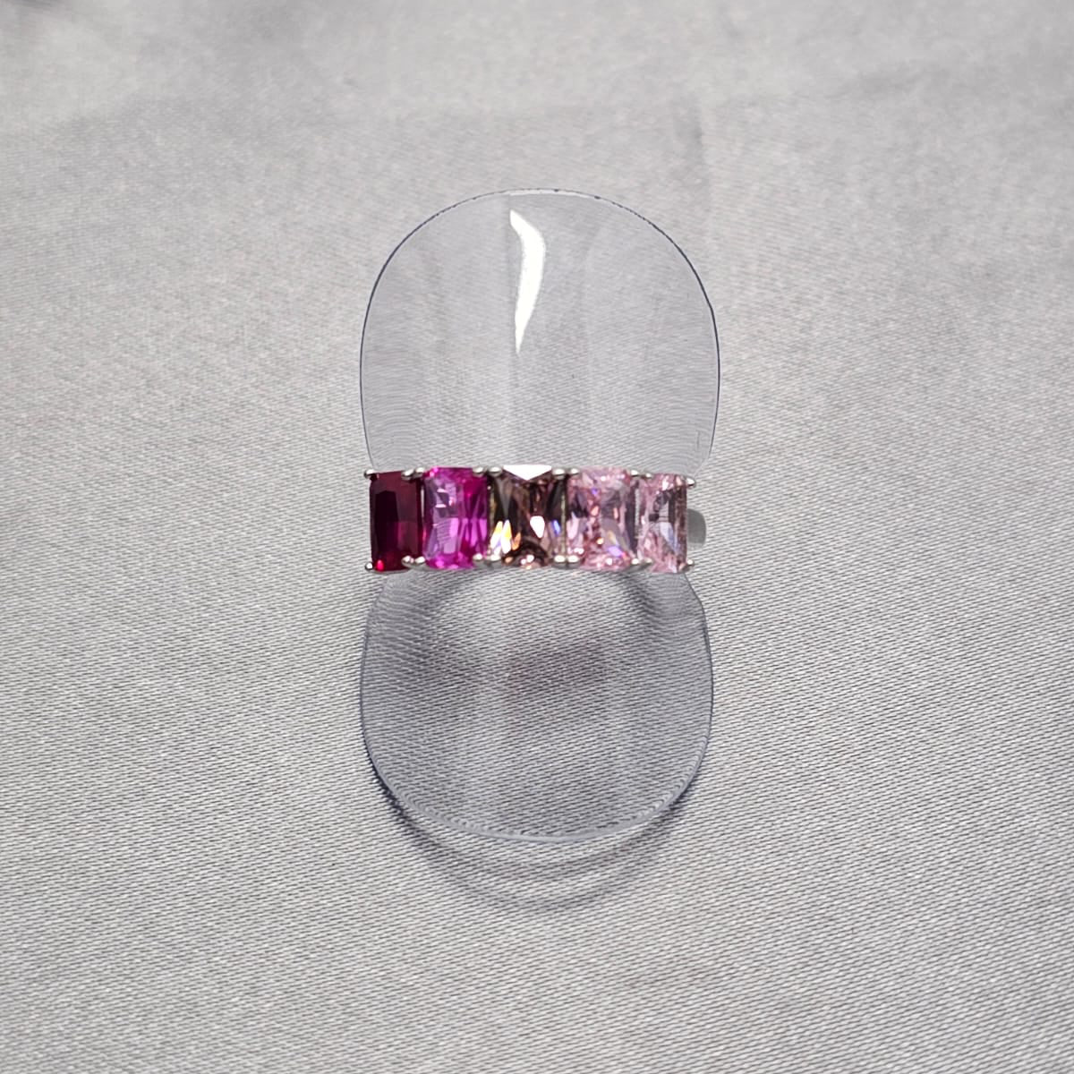 A sterling silver ring with intricate baguette cubic zirconia detailing, displayed on a plain background.