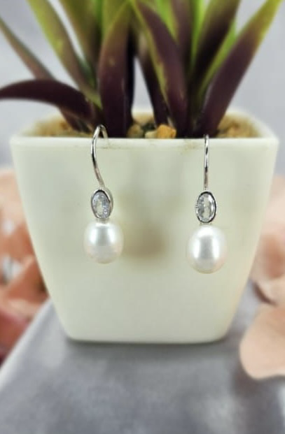 Elegant freshwater pearl drops with oval cubic in tube earrings