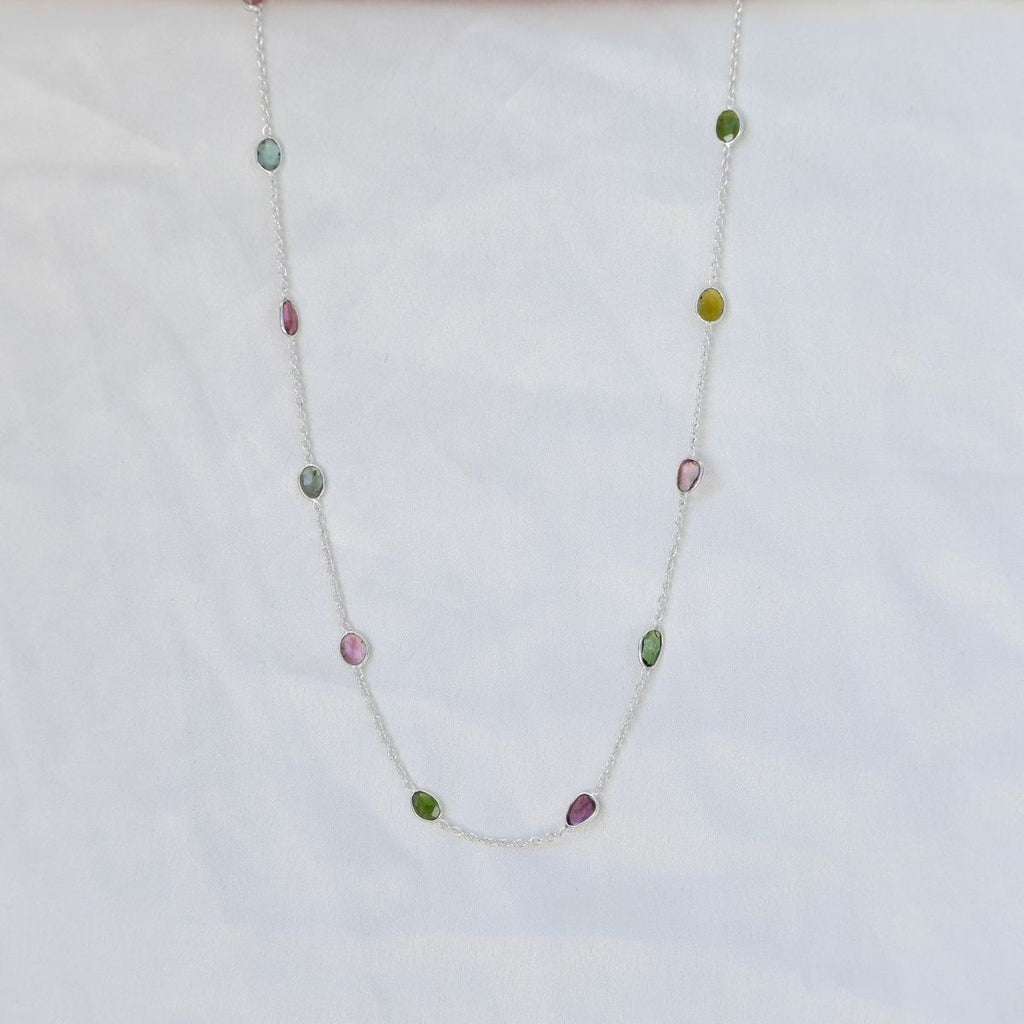 Necklace with multicolored beads on a white background