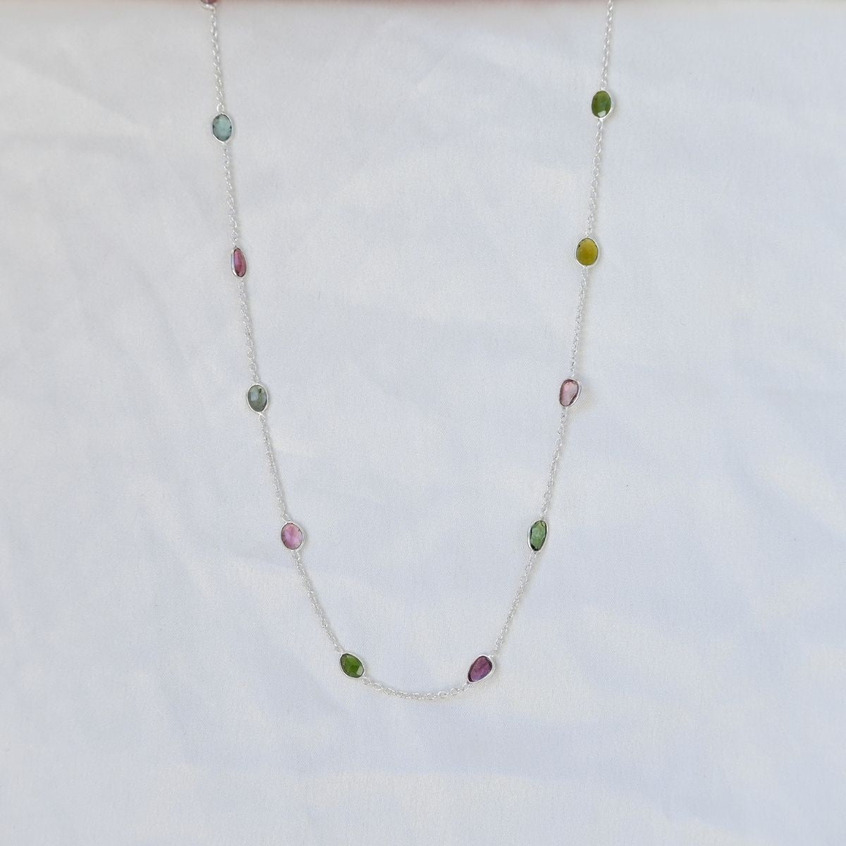 Necklace with multicolored beads on a white background