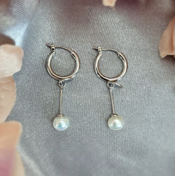 Long modern looking earrings with pretty freshwater pearl ends