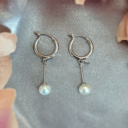 Long modern looking earrings with pretty freshwater pearl ends