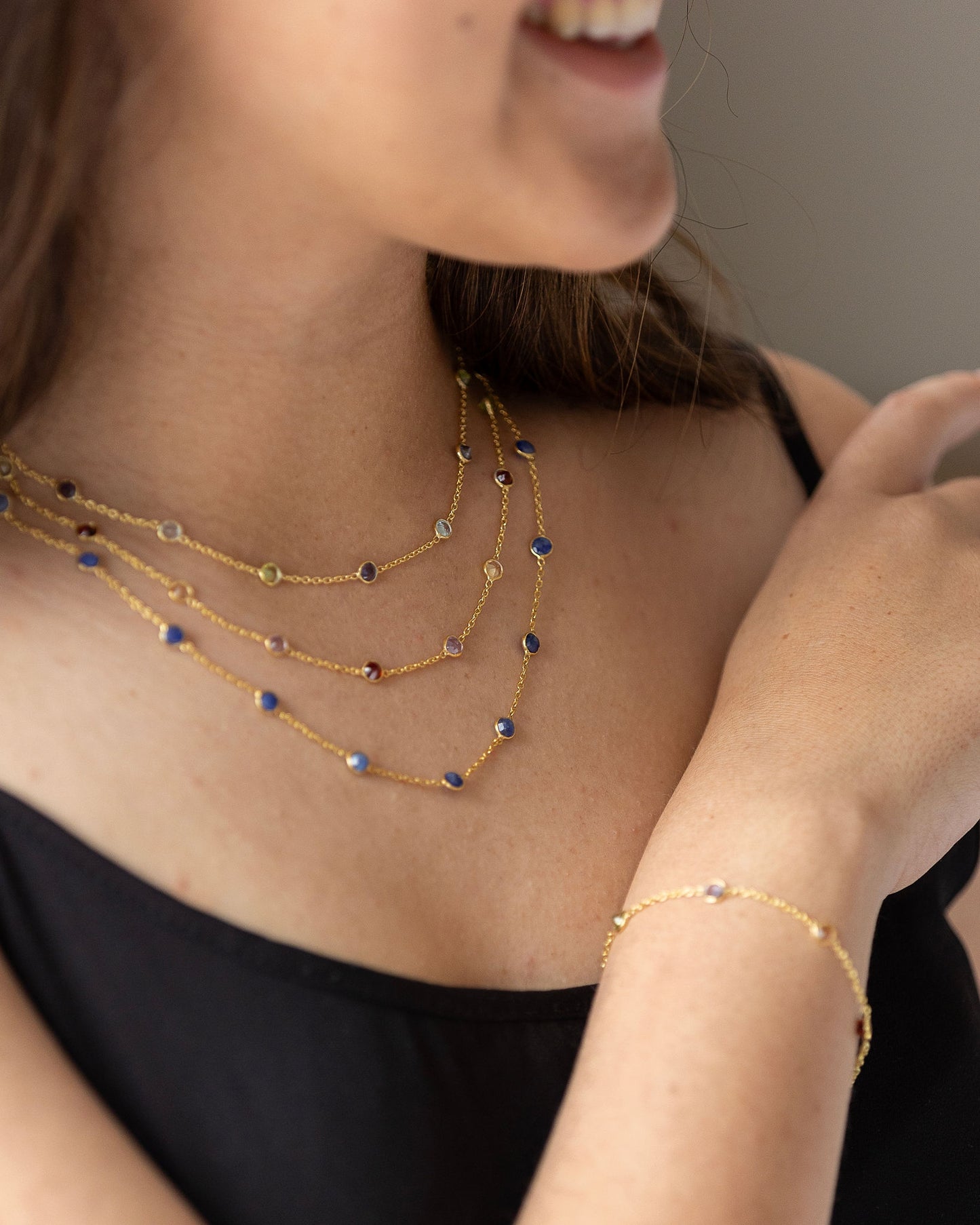 Stunning gold bracelet with shades of pink semi precious stones inbedded in chain