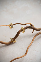 Golden Huggy Earrings With Diamond Shaped Cubic Zirconia