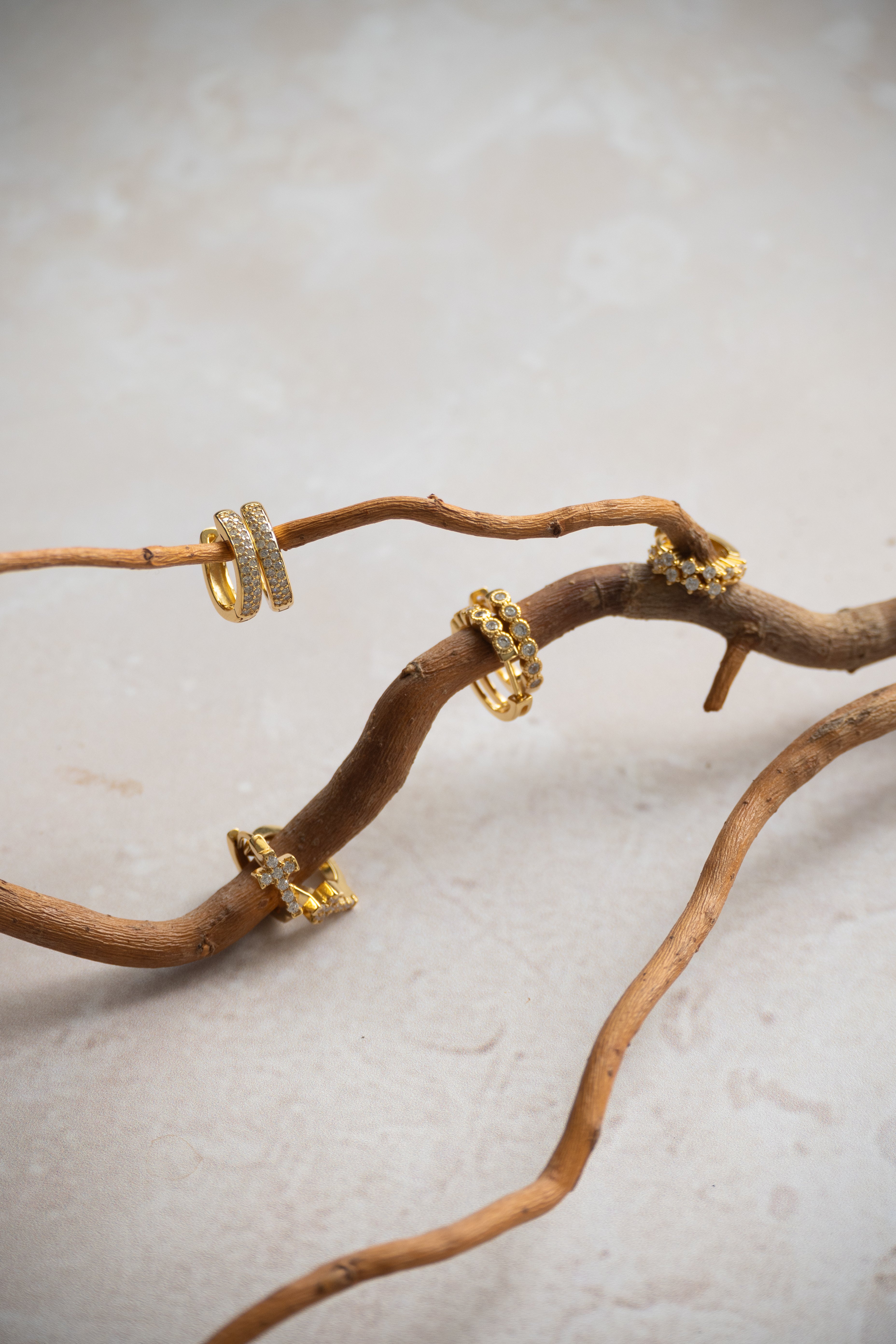 Golden Huggy Earrings With Diamond Shaped Cubic Zirconia