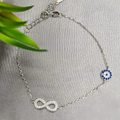 A sterling silver bracelet with a cubic zirconia detail, featuring a chain design and a single cubic zirconia embellishment.