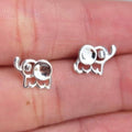 Silver elephant earrings on a hand