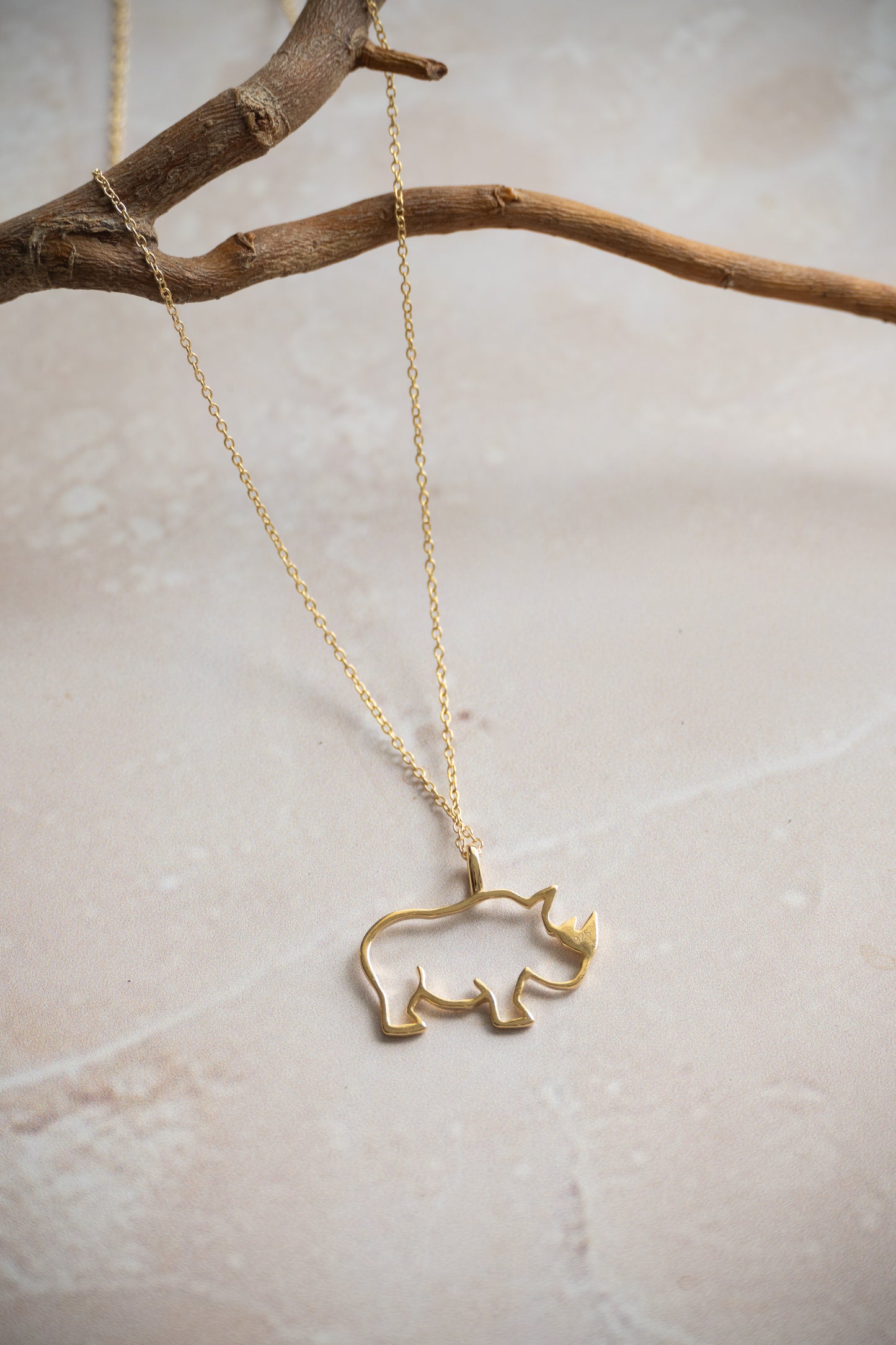 Outlined Rhino in gold or silver