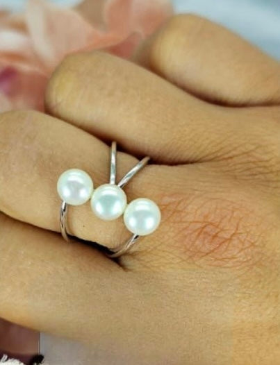 Stunning modern look sterling silver ring with cross silver bands and three stunning freshwater pearls in row