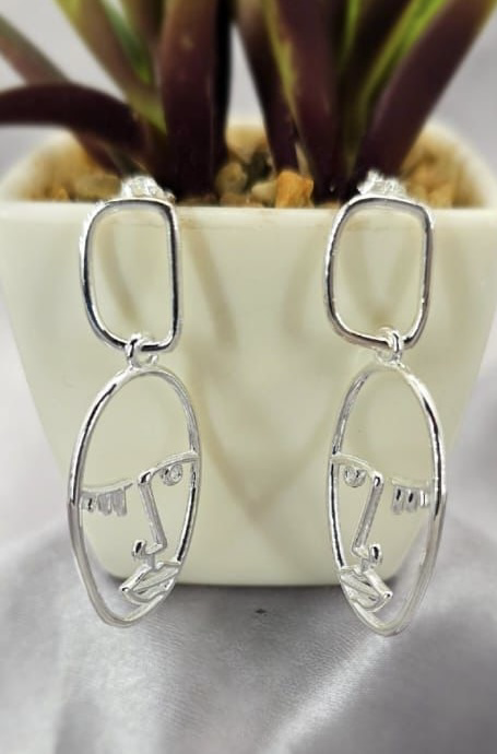 Long statement face drop earrings