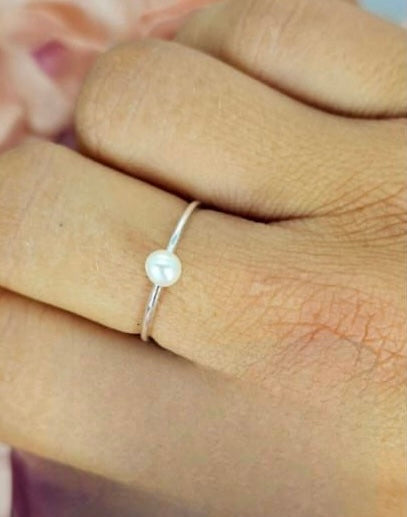 Adjustable sterling silver ring with tiny freshwater pearl