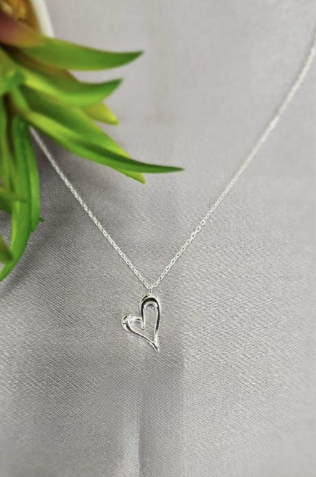 Sterling silver necklace with pretty heat pendant