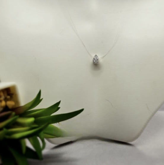 Teardrop cubic zirconia pendant on gut necklace