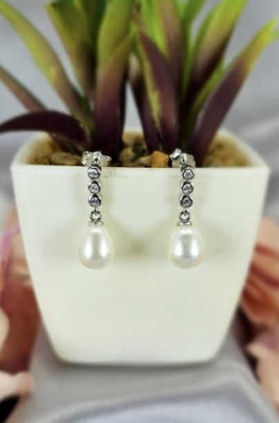 Beautiful pearls on modern looking earring