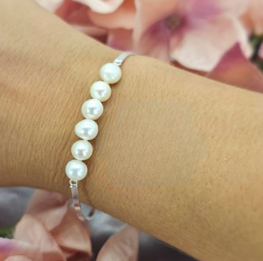 7 mm freshwater pearls Bracelet with sterling silver setting and clasp