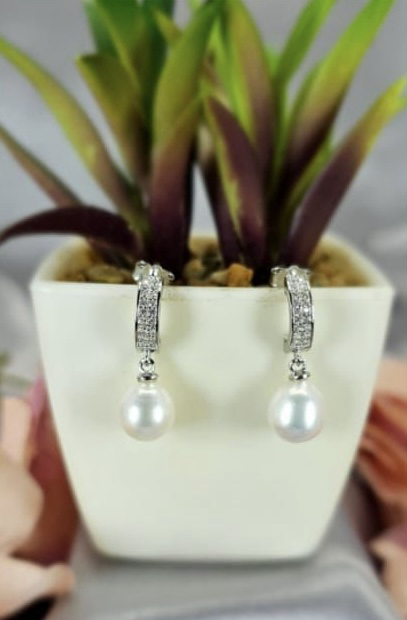 Sterling silver drop earrings with beautiful freshwater pearl and cubic zirconia detail