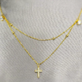 A double layered gold necklace with a gold-plated cross pendant on a chain, displayed against a fabric background.
