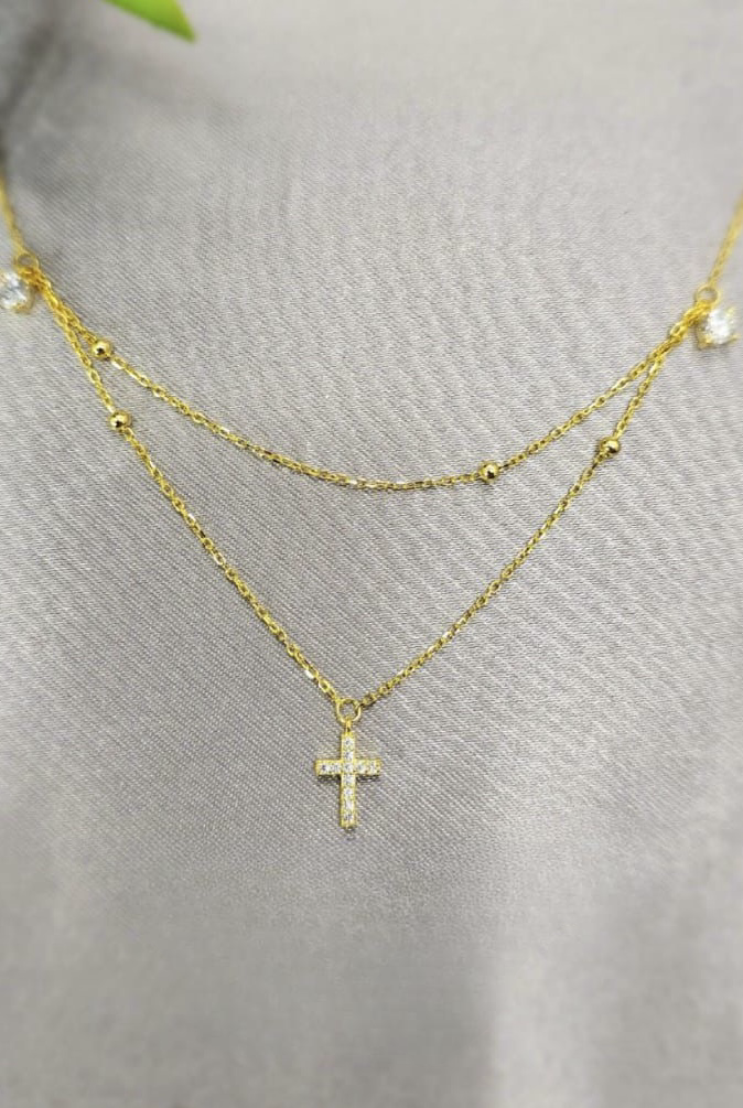 Double layered gold necklace with cross