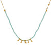 Necklace with small gold beads on a light blue cord