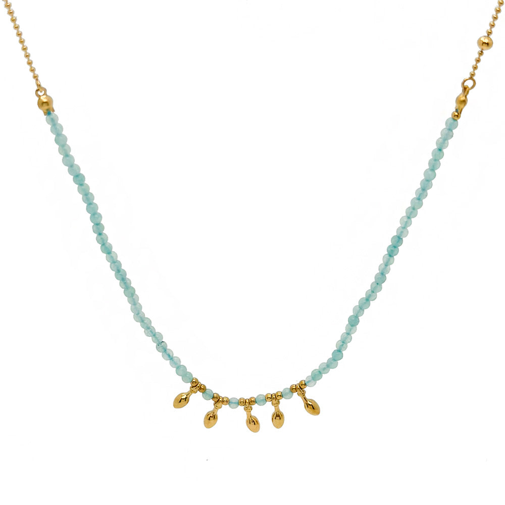 Necklace with light blue beads and gold accents on a white background