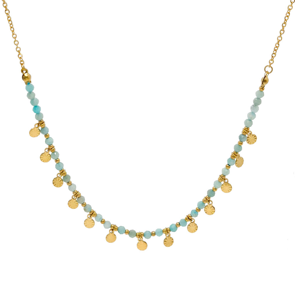 Necklace with gold and turquoise beads on a white background