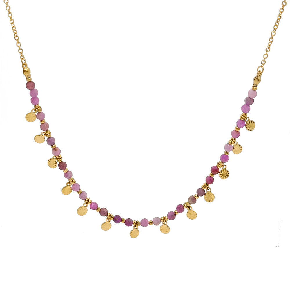 Necklace with pink beads and gold accents on a white background