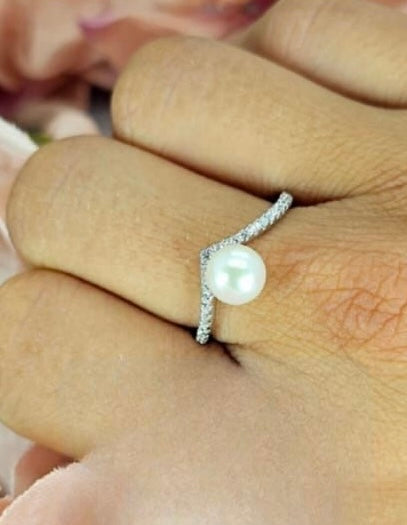 Sterling silver wishbone ring with cubic zirconia pavé detail and a freshwater Pearl centre