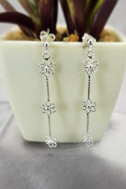 Three tiny daisy drop earrings