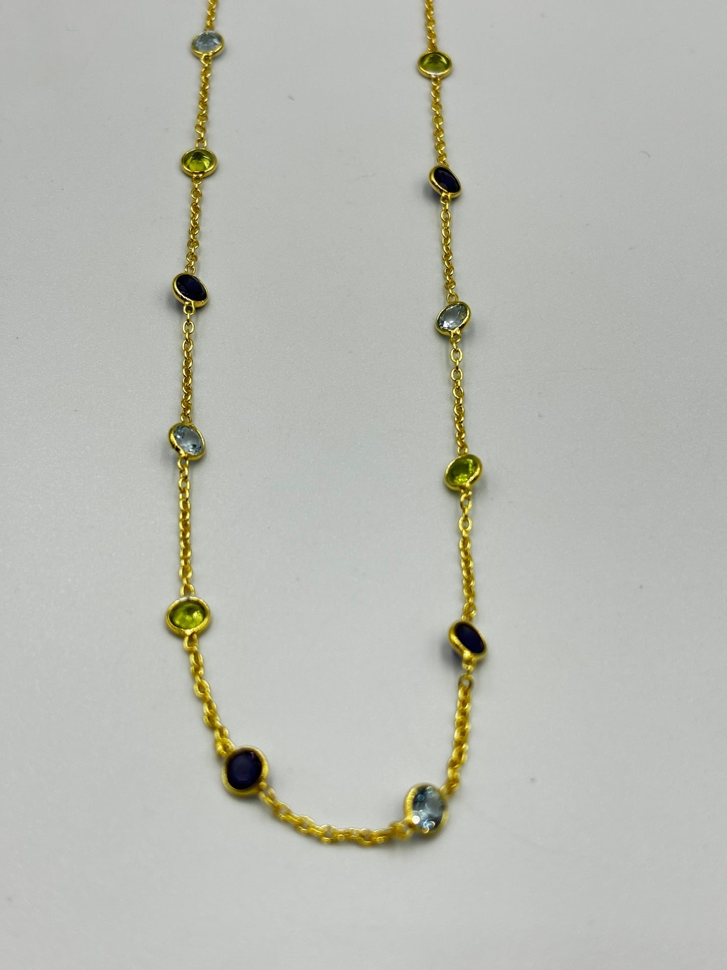 Stunning gold necklace with three different colours semi precious stones in chain