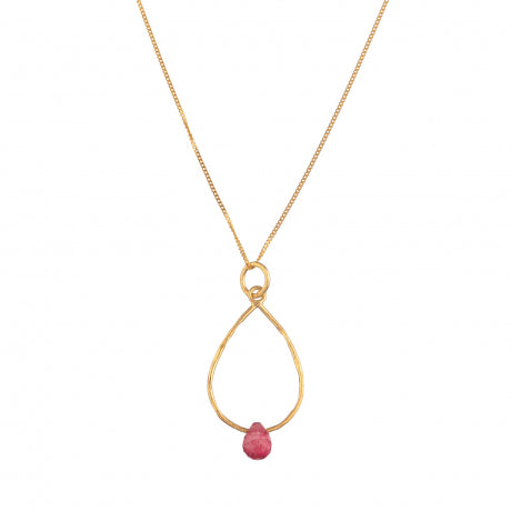 Gold necklace with a pink teardrop pendant on a white background