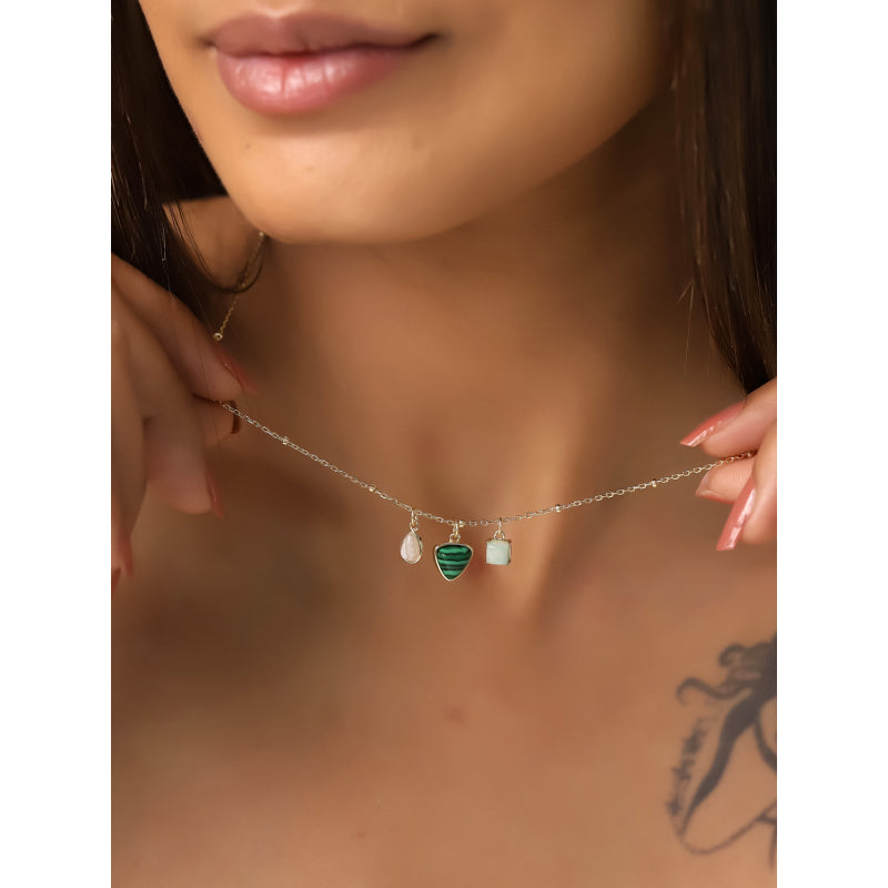 Necklace with heart-shaped pendants worn by a person