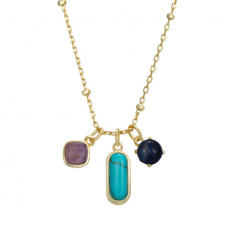 Gold necklace with three colored charms on a white background
